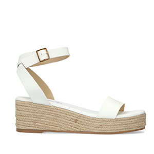 White soft sandals with a jute wedge