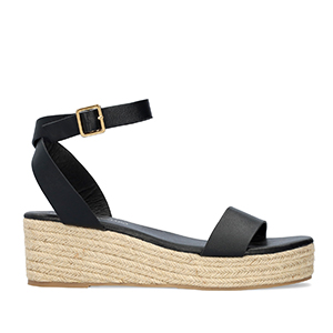 Black soft sandals with a jute wedge