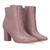 Heeled booties in mauve faux leather.