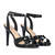 High heeled sandals in black patent material