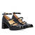 Heeled Mary Janes in black patent leather.