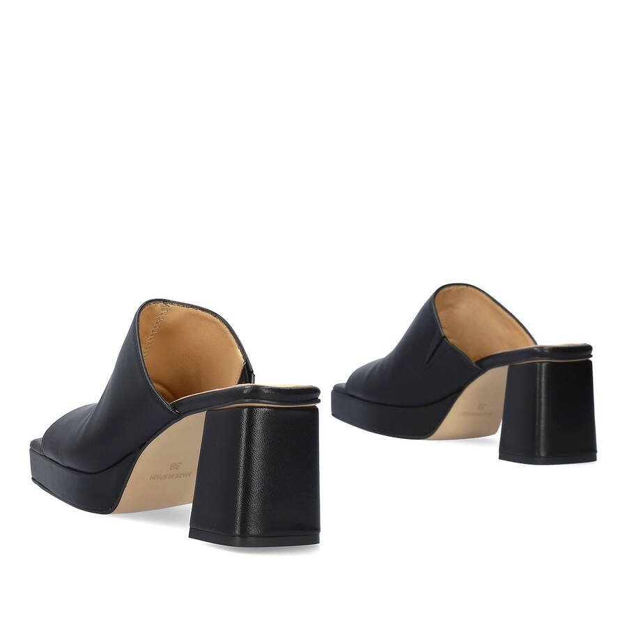 Heeled mules with platform in black leather 