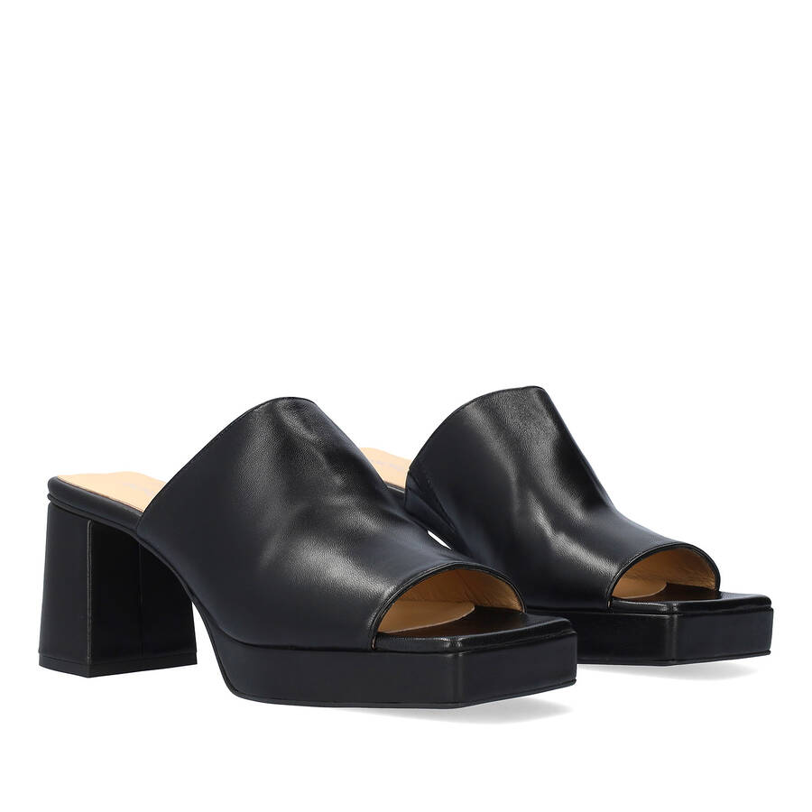 Heeled mules with platform in black leather 