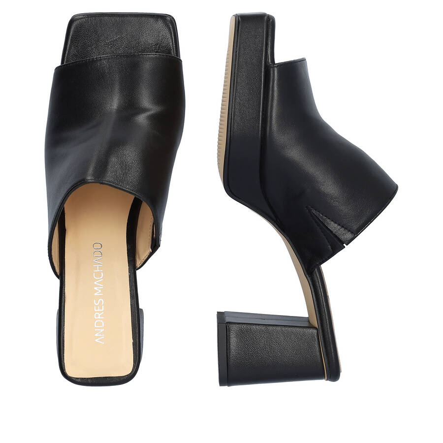 Heeled mules with platform in black leather 