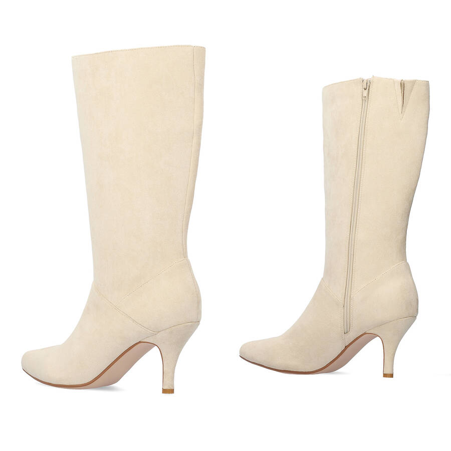 Heeled high boots in off white faux suede. 