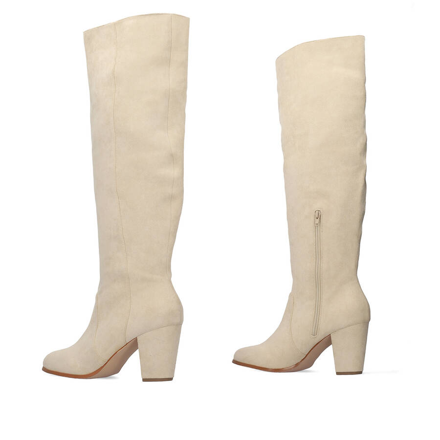 Heeled knee-high boots in off-white faux suede. 