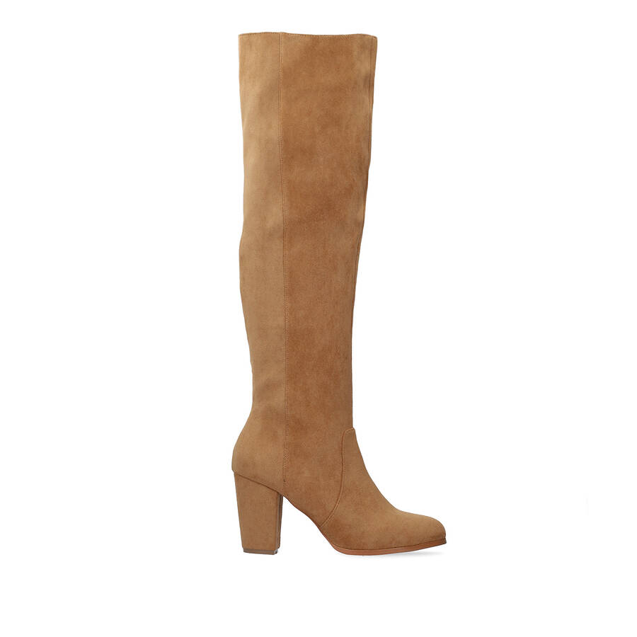 Heeled knee-high boots in brown faux suede. 