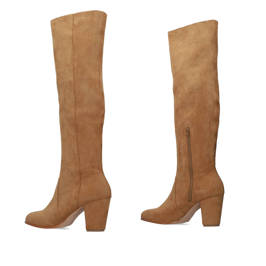 Heeled knee-high boots in brown faux suede. 