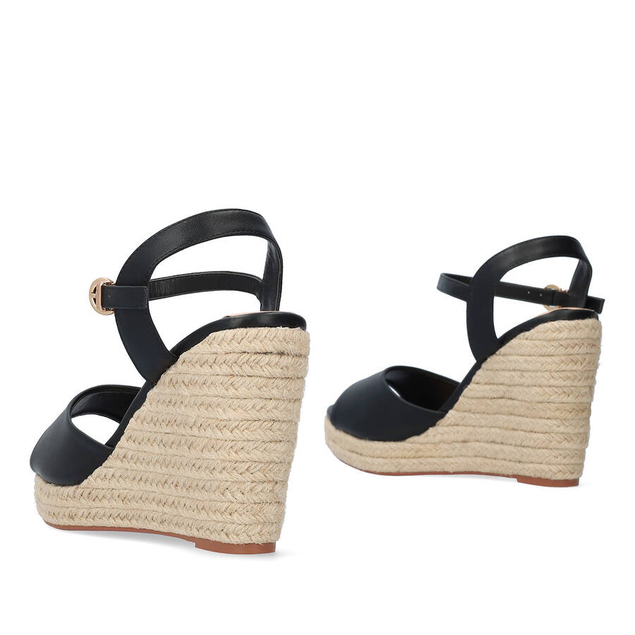 Black soft fabric sandal with a jute wedge 