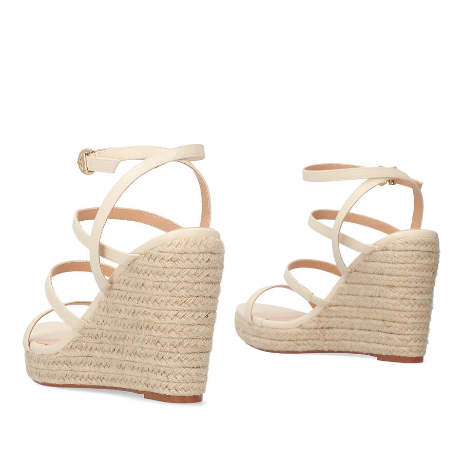 Beige soft fabric sandal with a jute wedge 