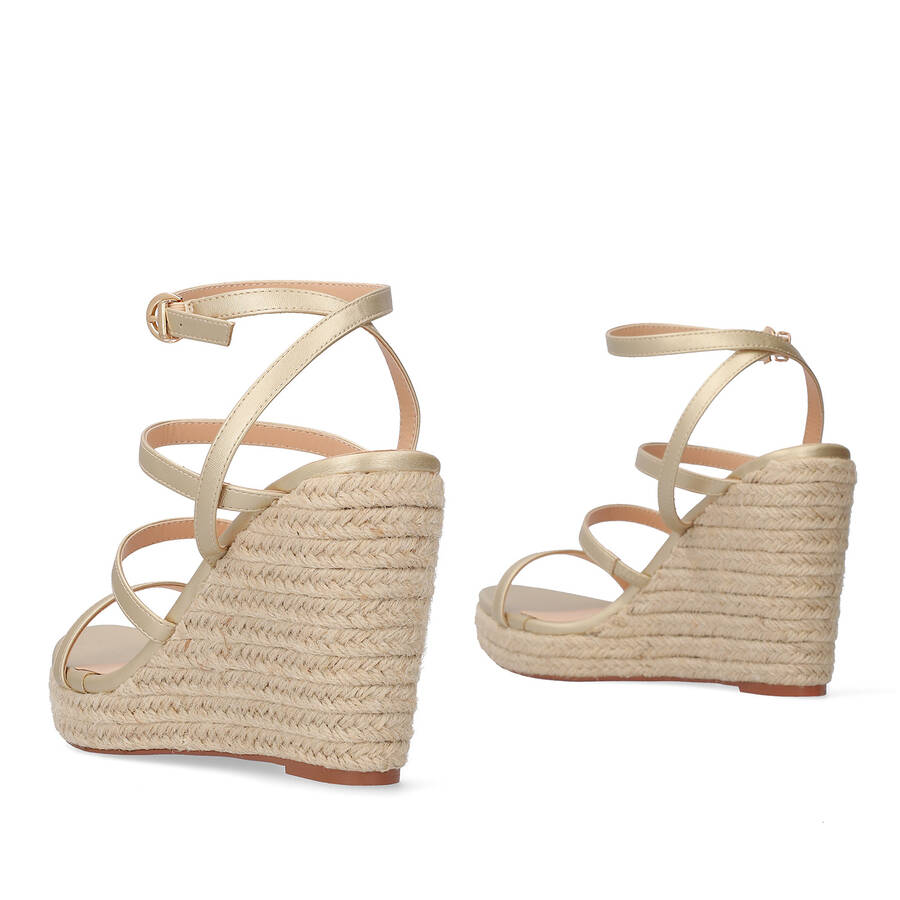 Golden soft fabric sandal with a jute wedge 