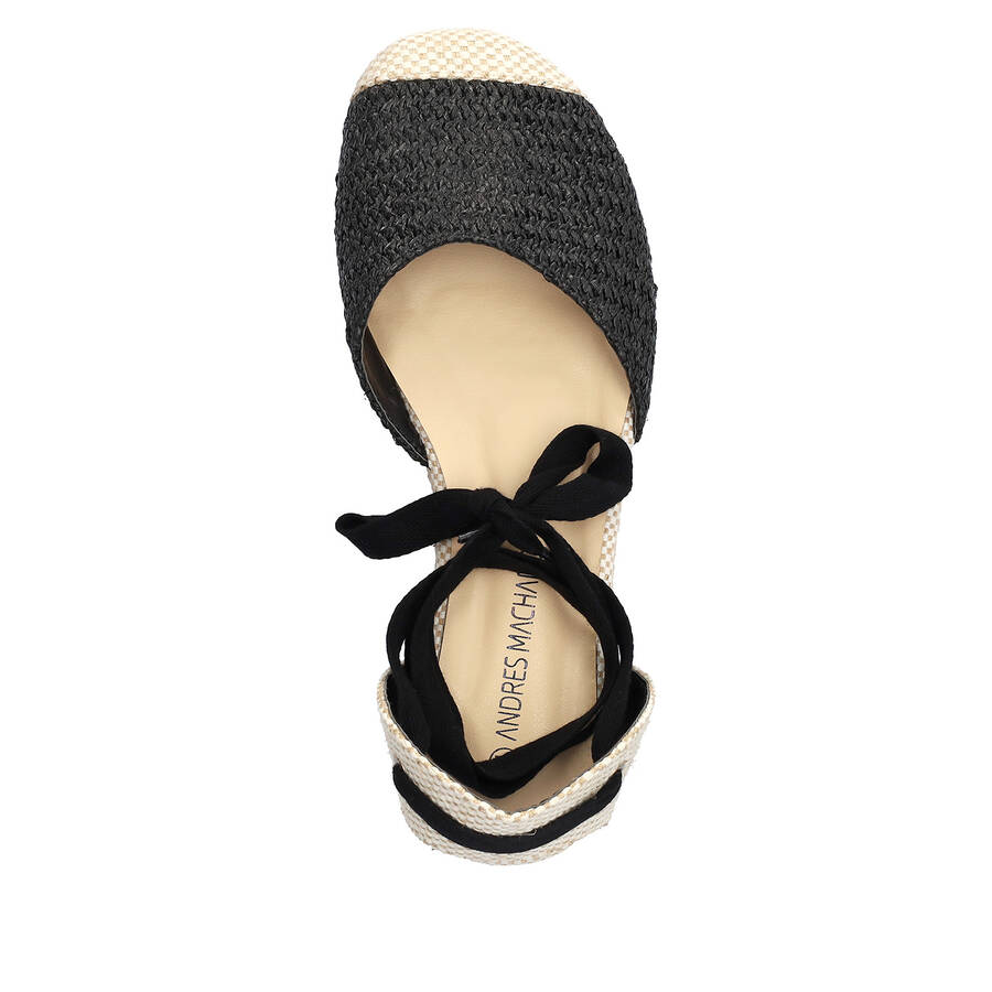 Wedge sandals in black-colored fabric with jute wedge 