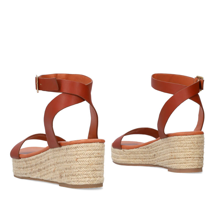 Brown soft sandals with a jute wedge 