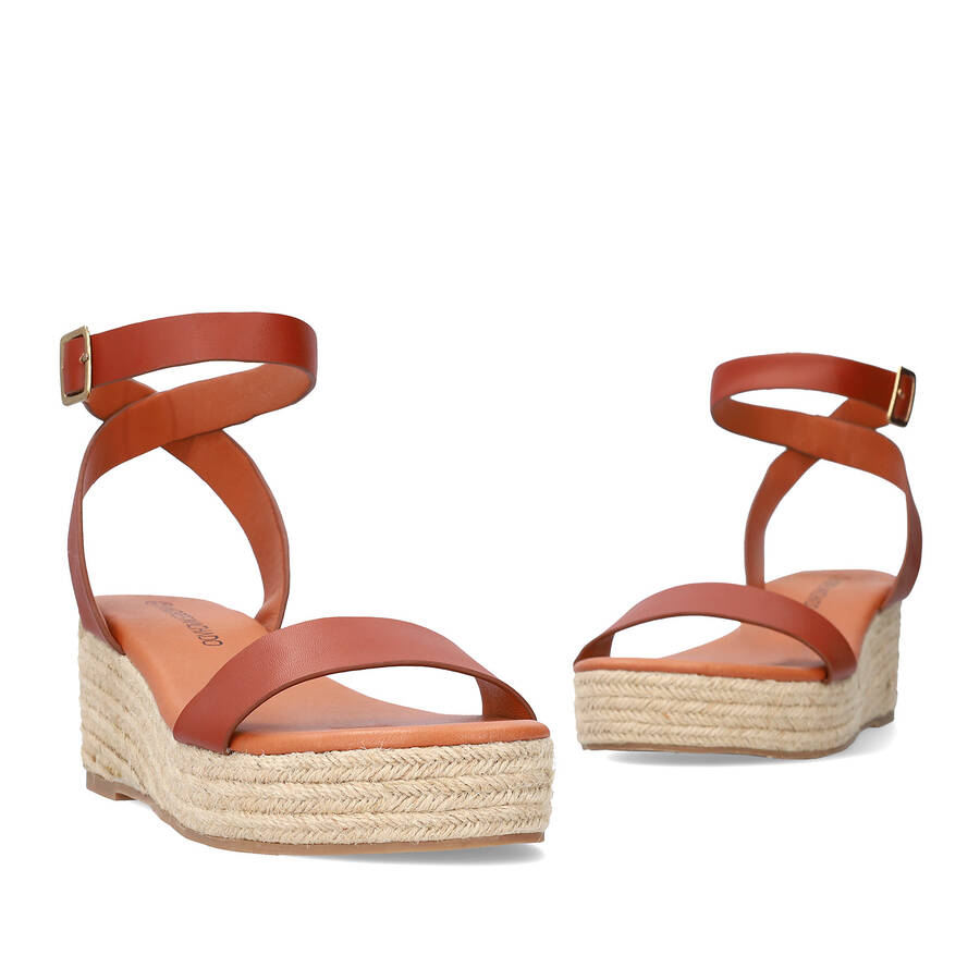 Brown soft sandals with a jute wedge 