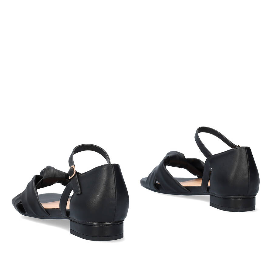 Flat sandals in soft black colored material 