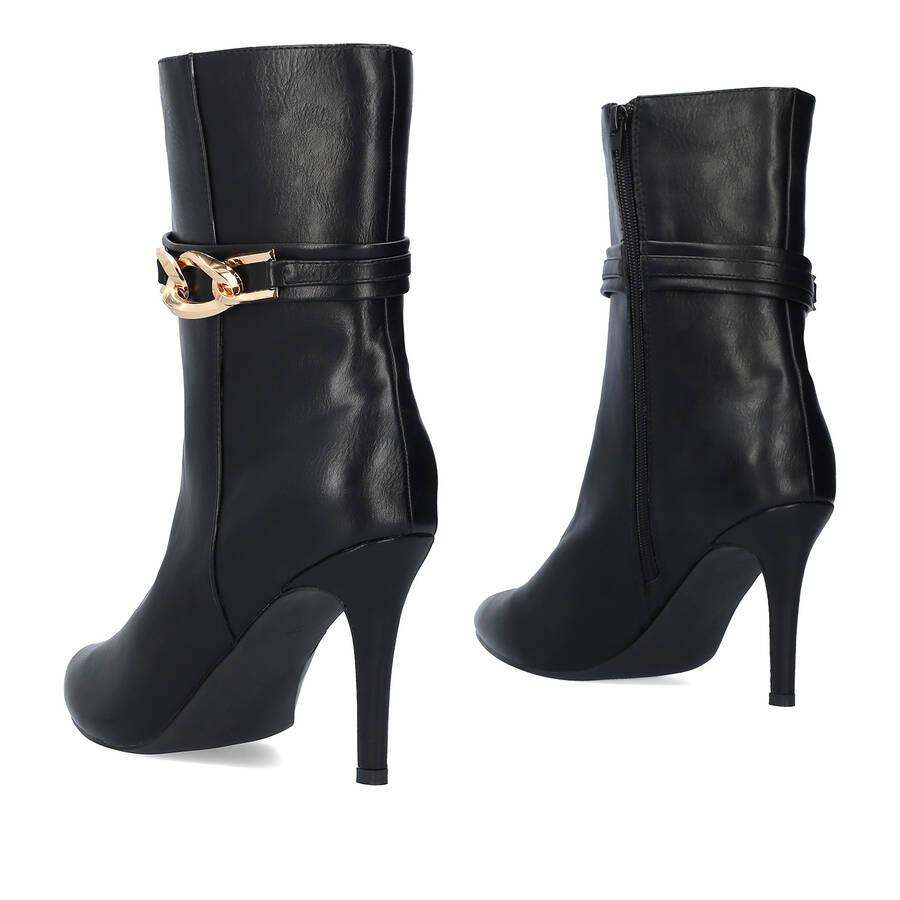 Heeled booties in soft black faux leather 