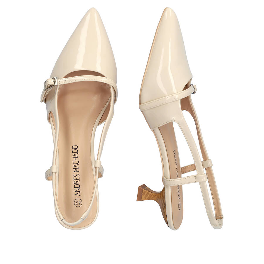 Slingback beige patent shoes with a kitten heel 