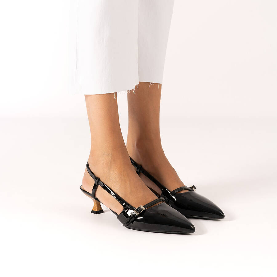 Slingback black patent shoes with a kitten heel 