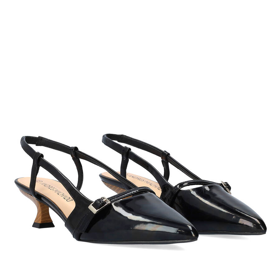 Slingback black patent shoes with a kitten heel 