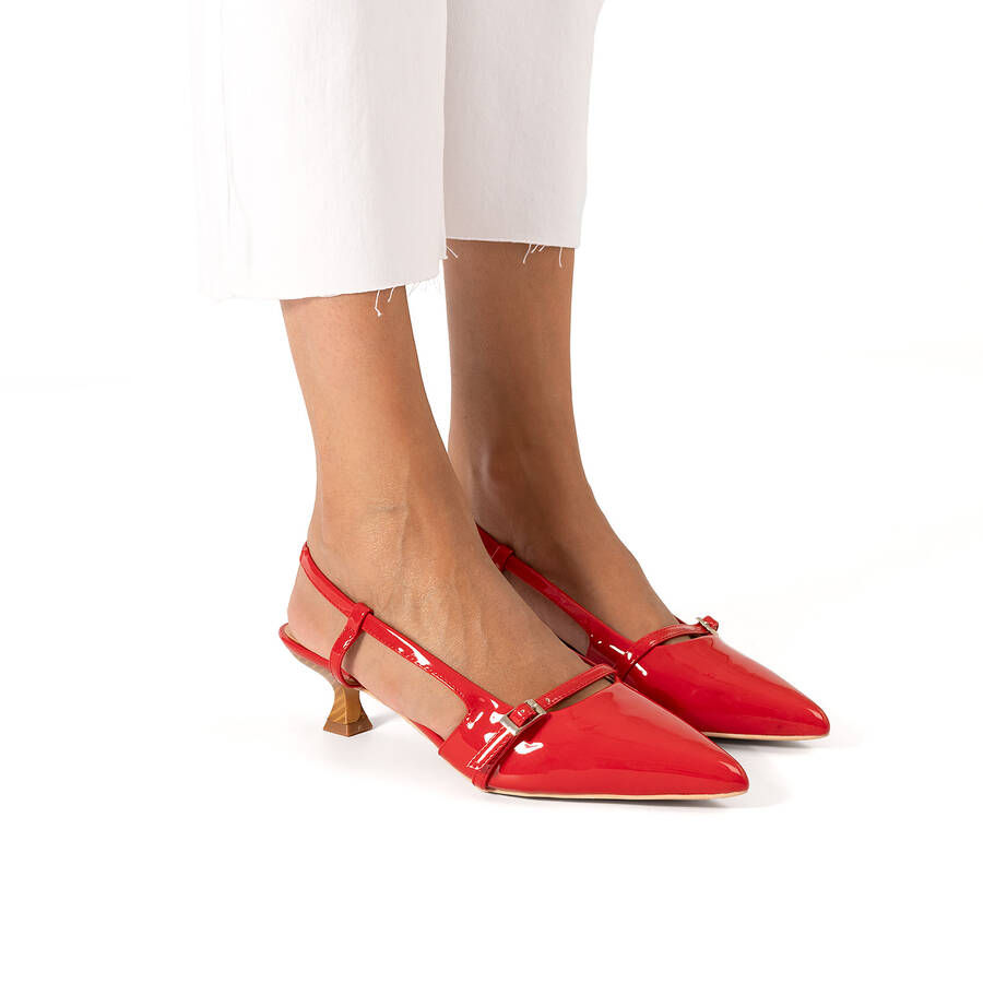 Slingback red patent shoes with a kitten heel 