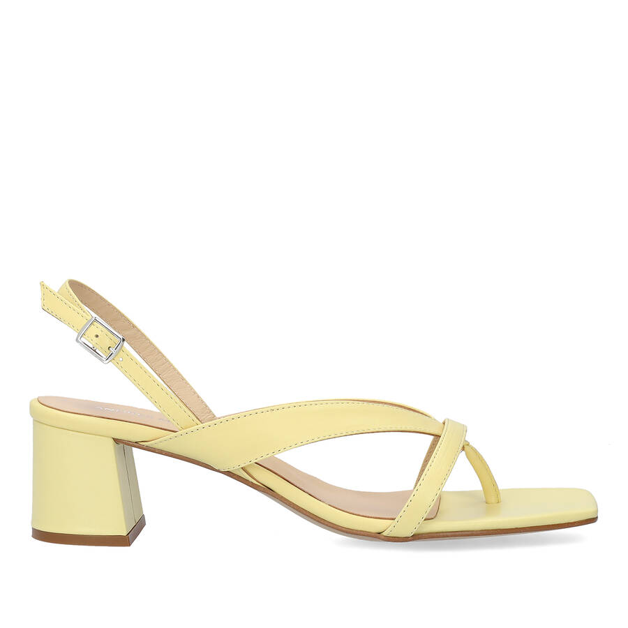 Heeled sandals in yellow leather 