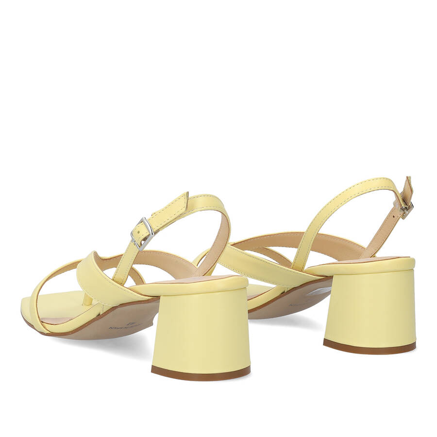 Heeled sandals in yellow leather 