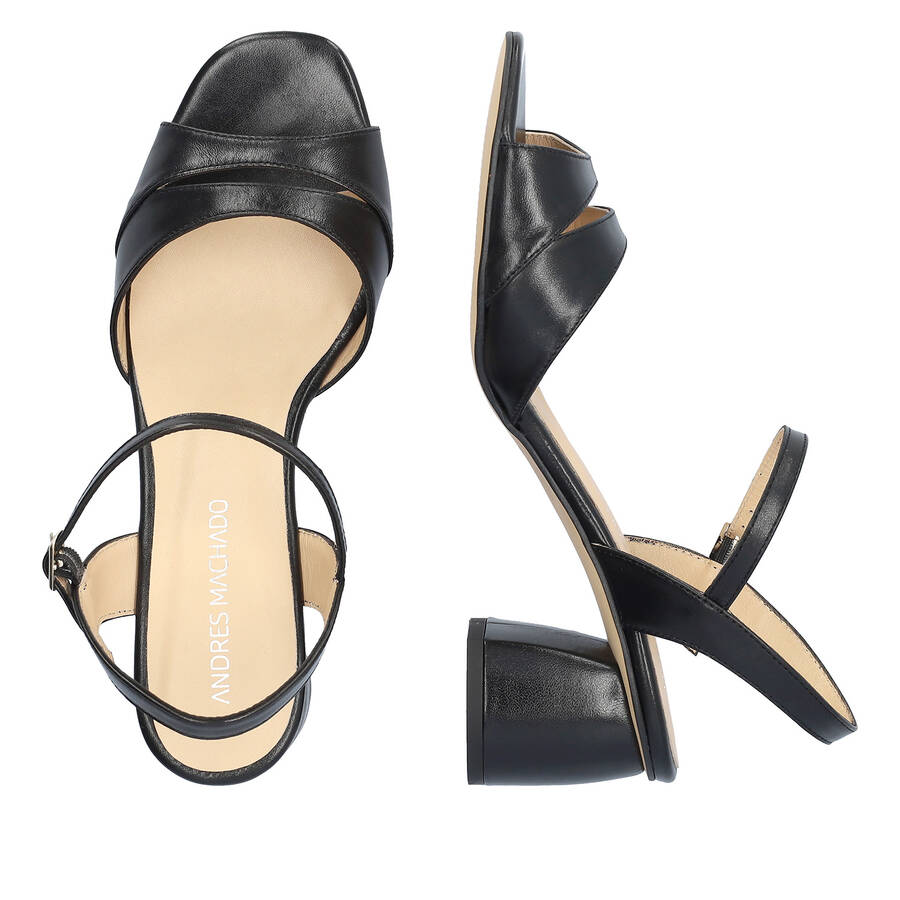 Heeled leather sandals in black colour 