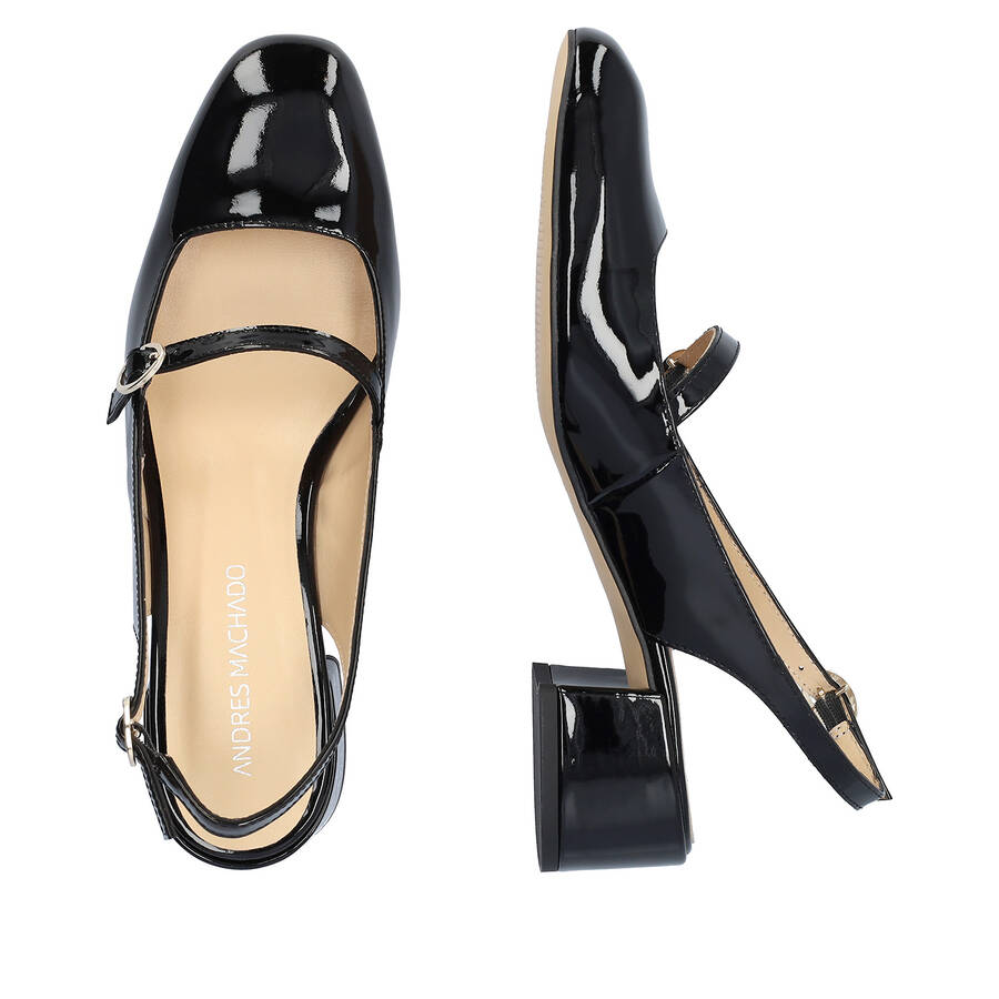 Heeled black patent leather Mary Janes 