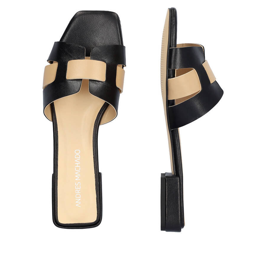 Flat sandals in black and beige leather 