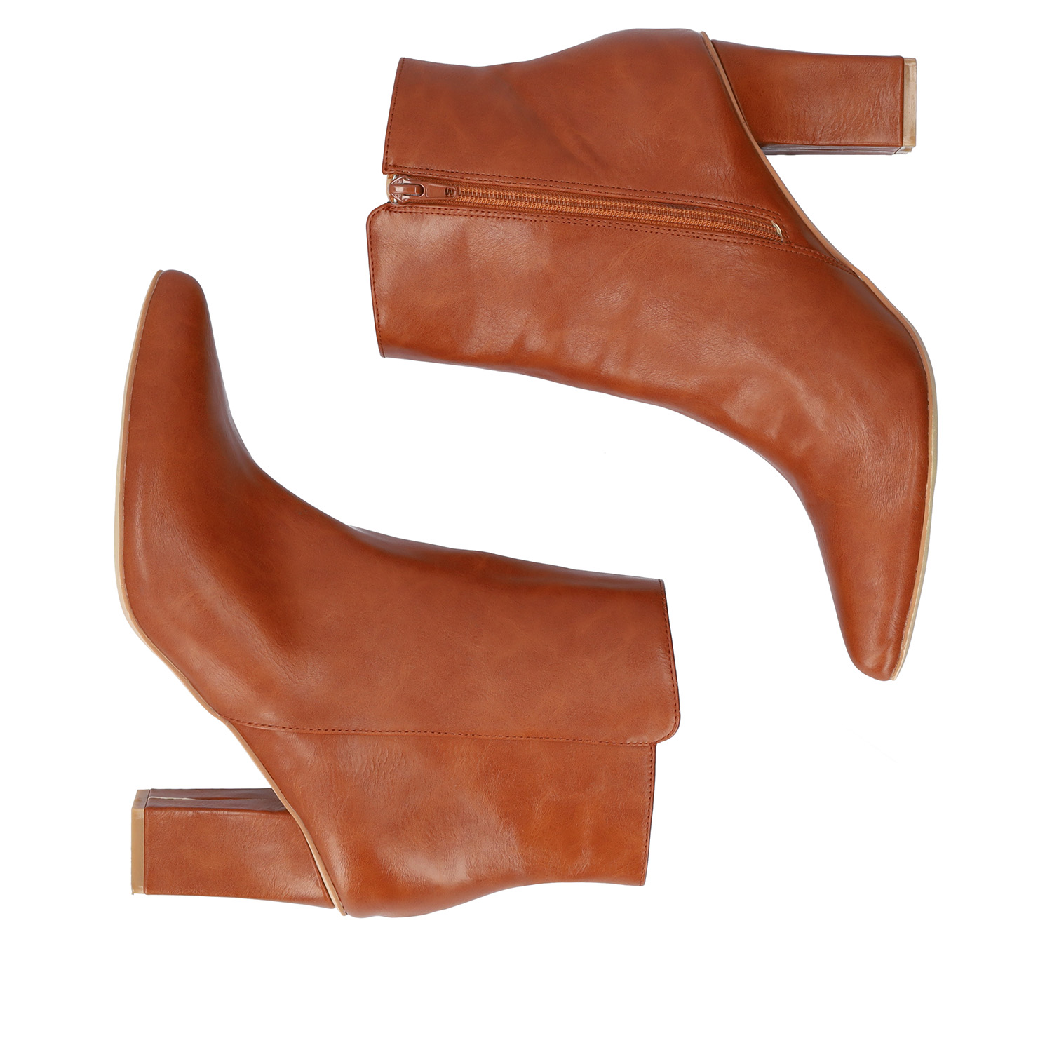Heeled booties in brown faux leather. 