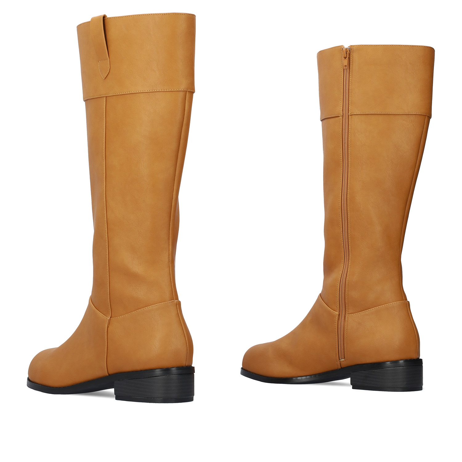 Flat high-calf boots in camel faux leather. 