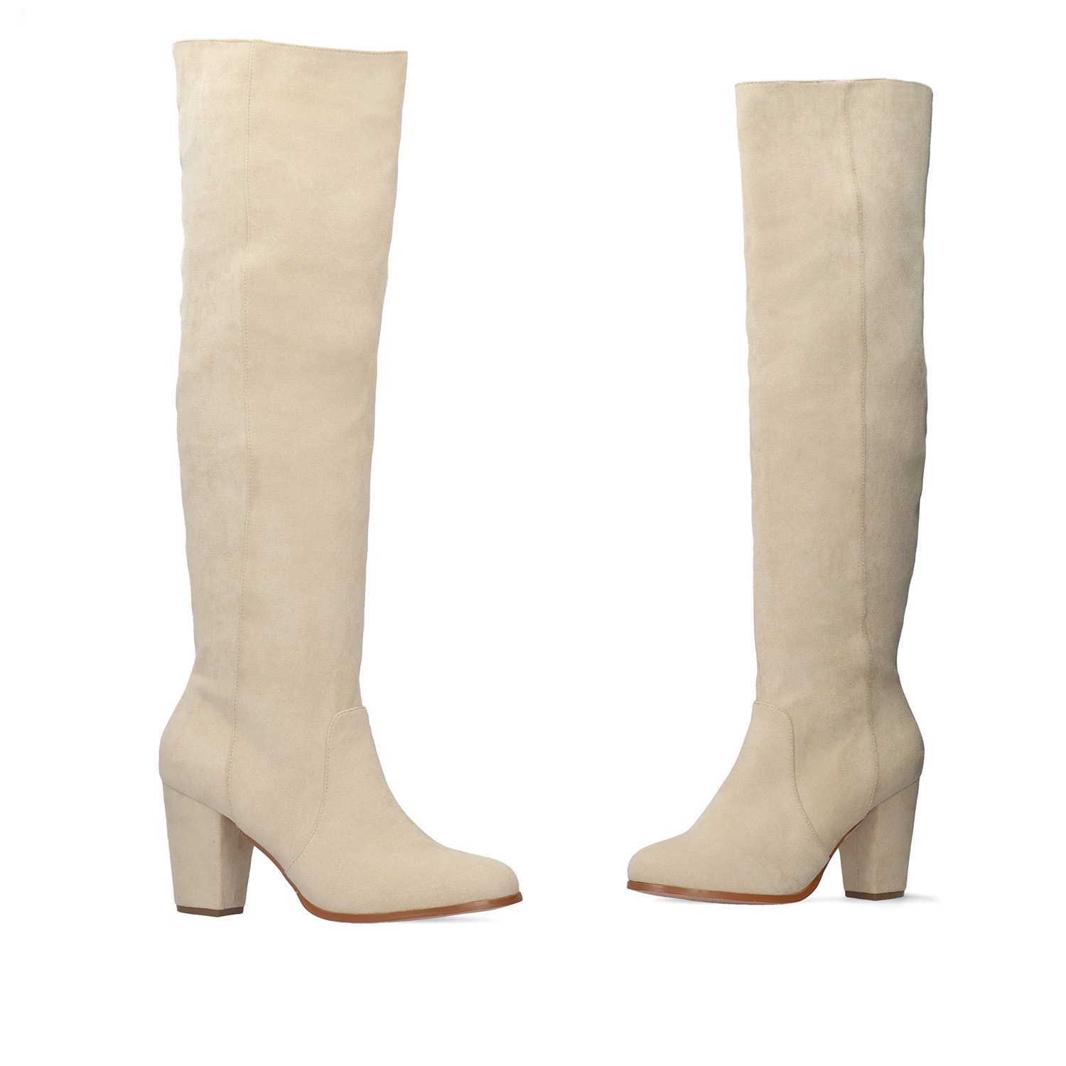 Heeled knee-high boots in off-white faux suede. 
