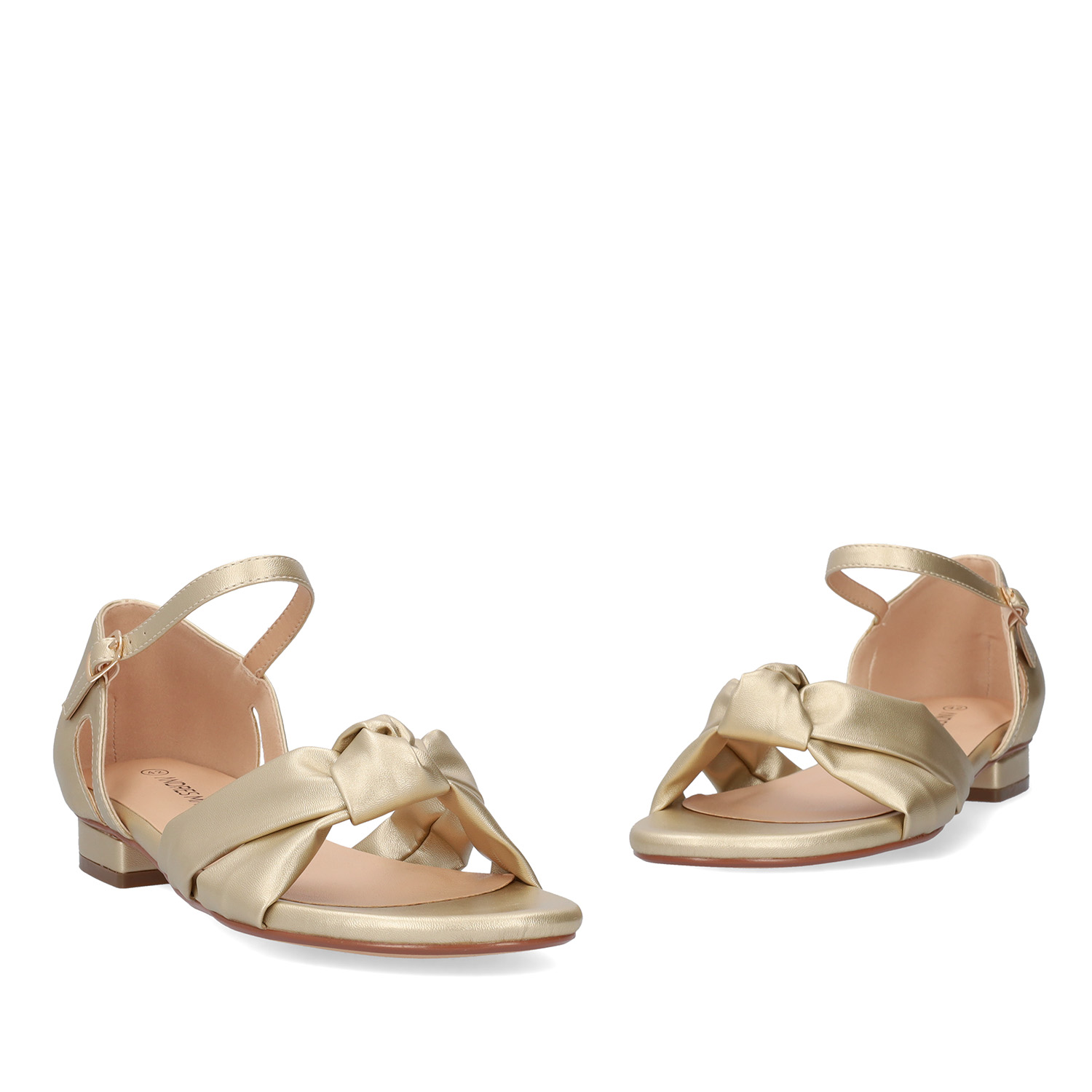 Flat sandals in soft golden colored material 