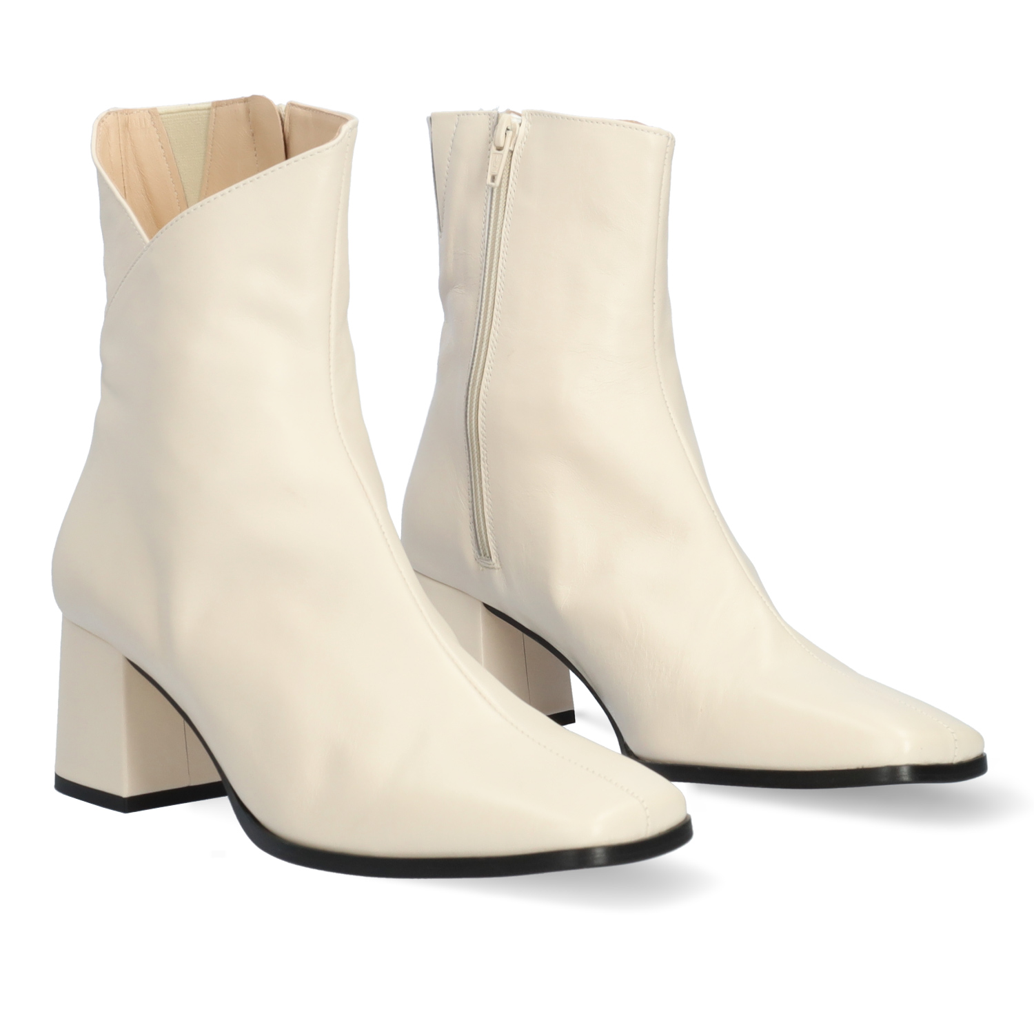 Heeled booties in off-white leather 